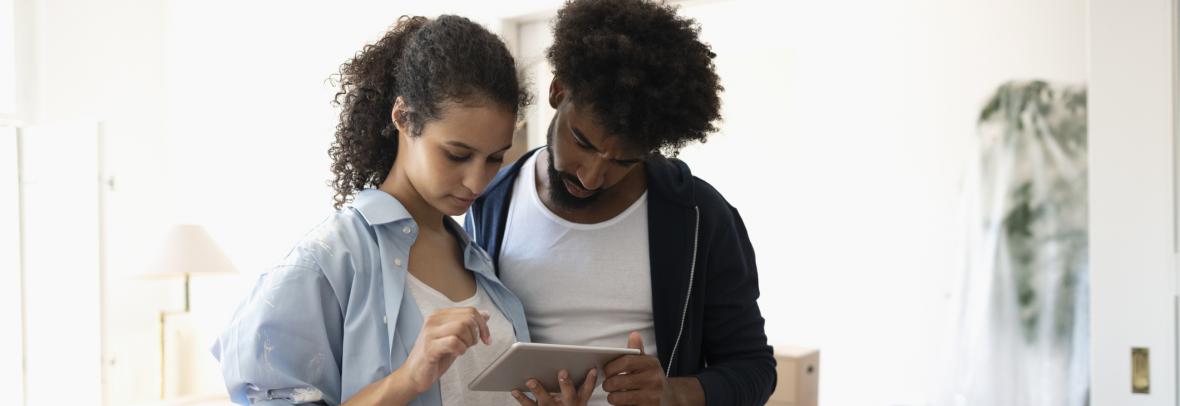 couple reading over important information provided by the realtor